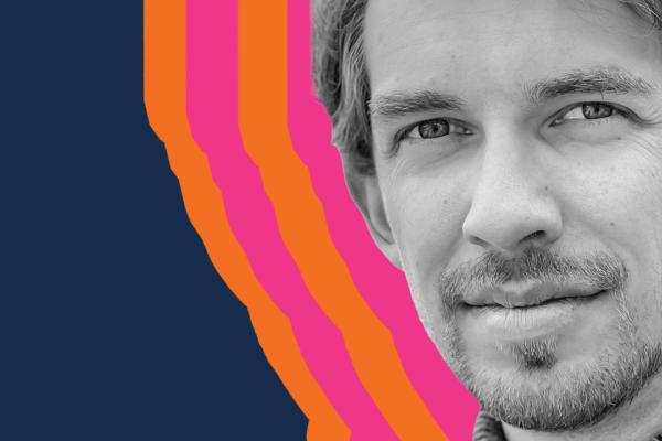 Headshot of composer cellist Nicholas Denton Protsack outlined in pink and orange onn a navy blue backgroud
